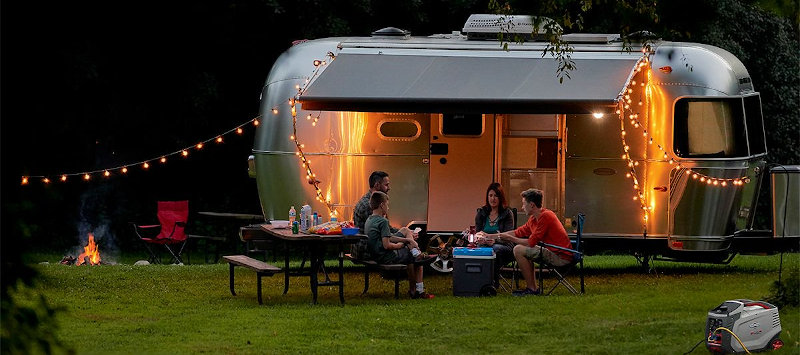Briggs and Stratton P3000 Portable Inverter Generator Powering a Travel Trailer at an RV Park